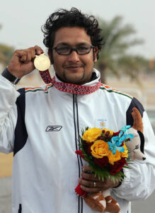 jaspal-rana-of-india-displays-the-gold-medal-won-during-the-mens-shooting-25m-centre-fire