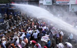 Police_use_water_cannons_and_tear_gas_to_di.max-1400x700
